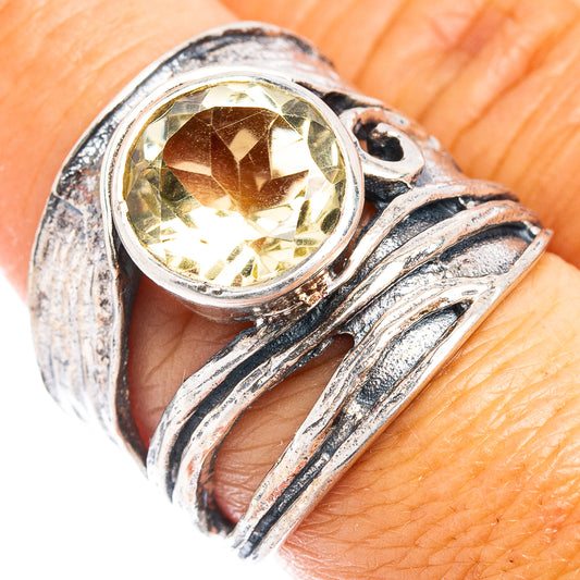 Sterling silver ring with round lemon quartz center and ornate swirl band