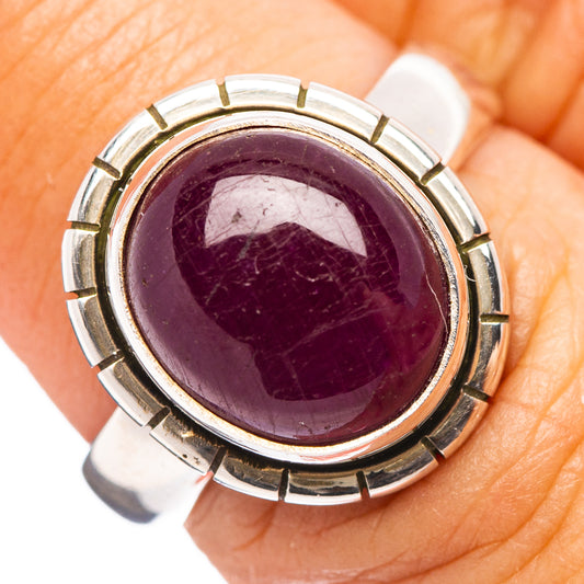 Sterling silver ruby ring with round purple gemstone bezel with segmented metal accents