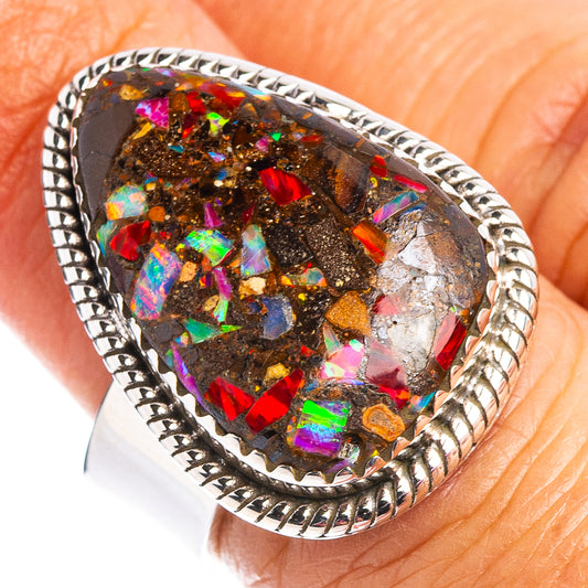 Sterling silver ring with oval boulder opal matrix center, colorful rainbow flecks