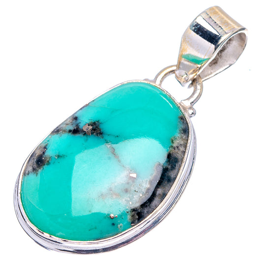 Oval turquoise pendant with silver bezel and top bail, side view of stone setting.