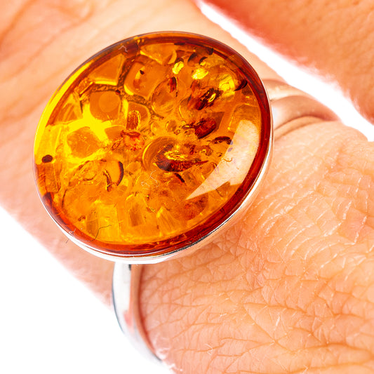 Oval amber cabochon set in .925 sterling silver ring band