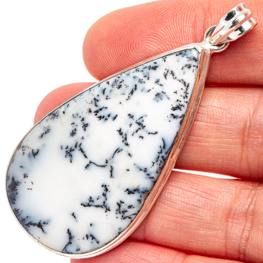 Dendritic agate pendant with blue-black dendrite patterns, set in sterling silver frame