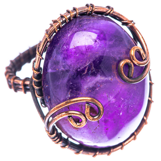 Oxidized copper wire wrap ring featuring purple amethyst cabochon with side loops