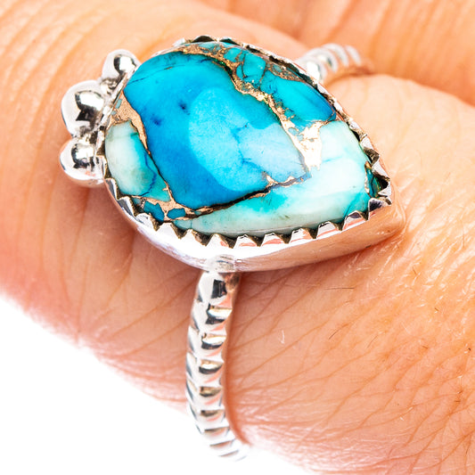 Sterling silver ring with oval turquoise cabochon and ornate prong setting