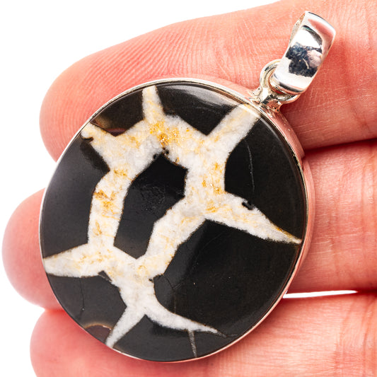 Black septarian gemstone pendant in .925 sterling silver bezel, round with star veining