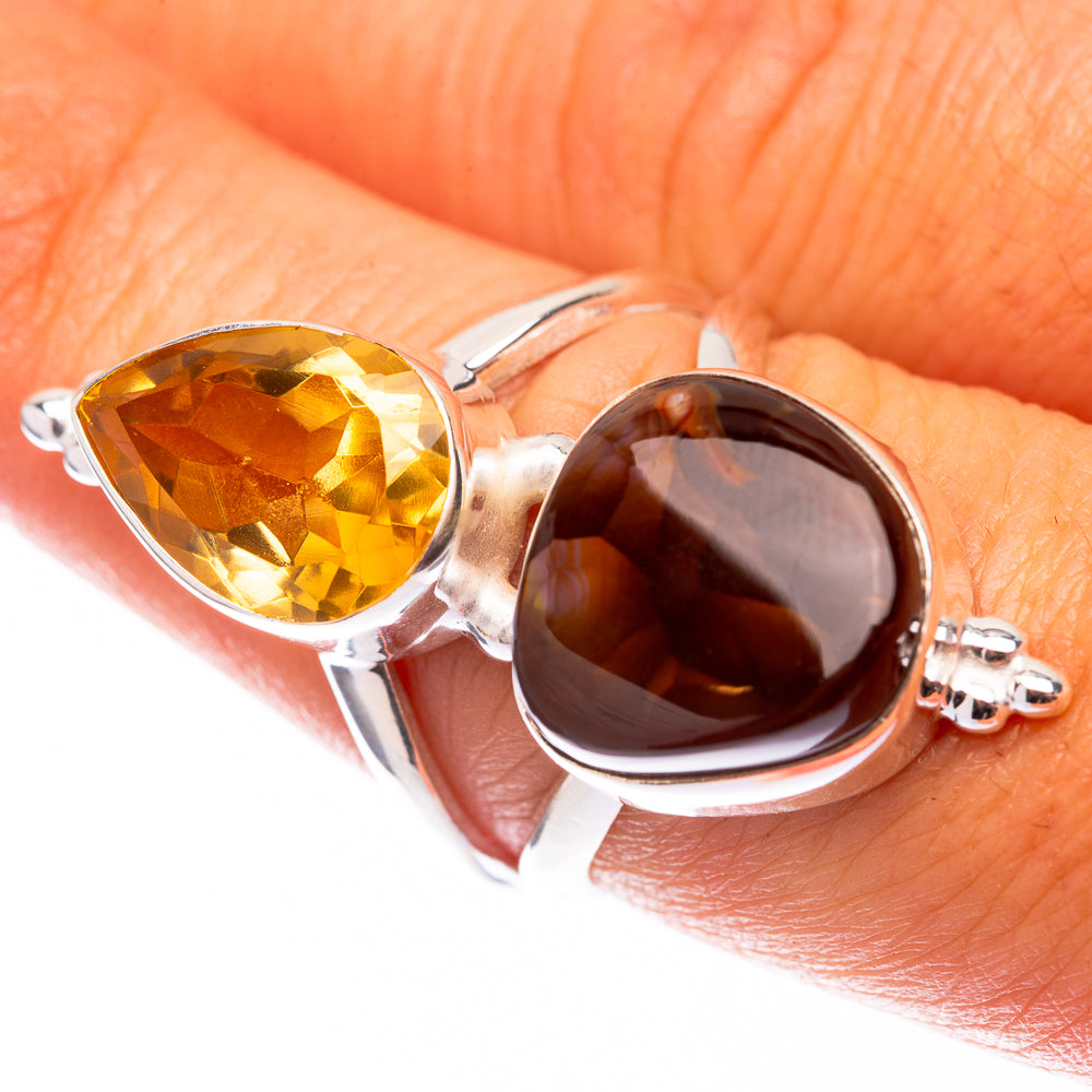 Sterling silver ring with oval faceted yellow and dark red gemstones