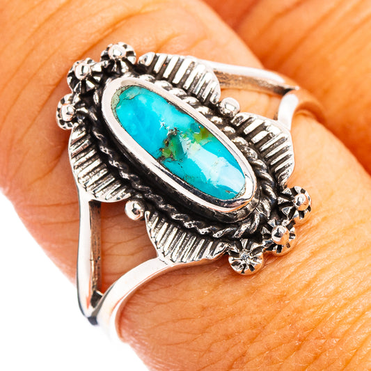 Turquoise oval sterling silver ring with ornate bezel and small bead accents
