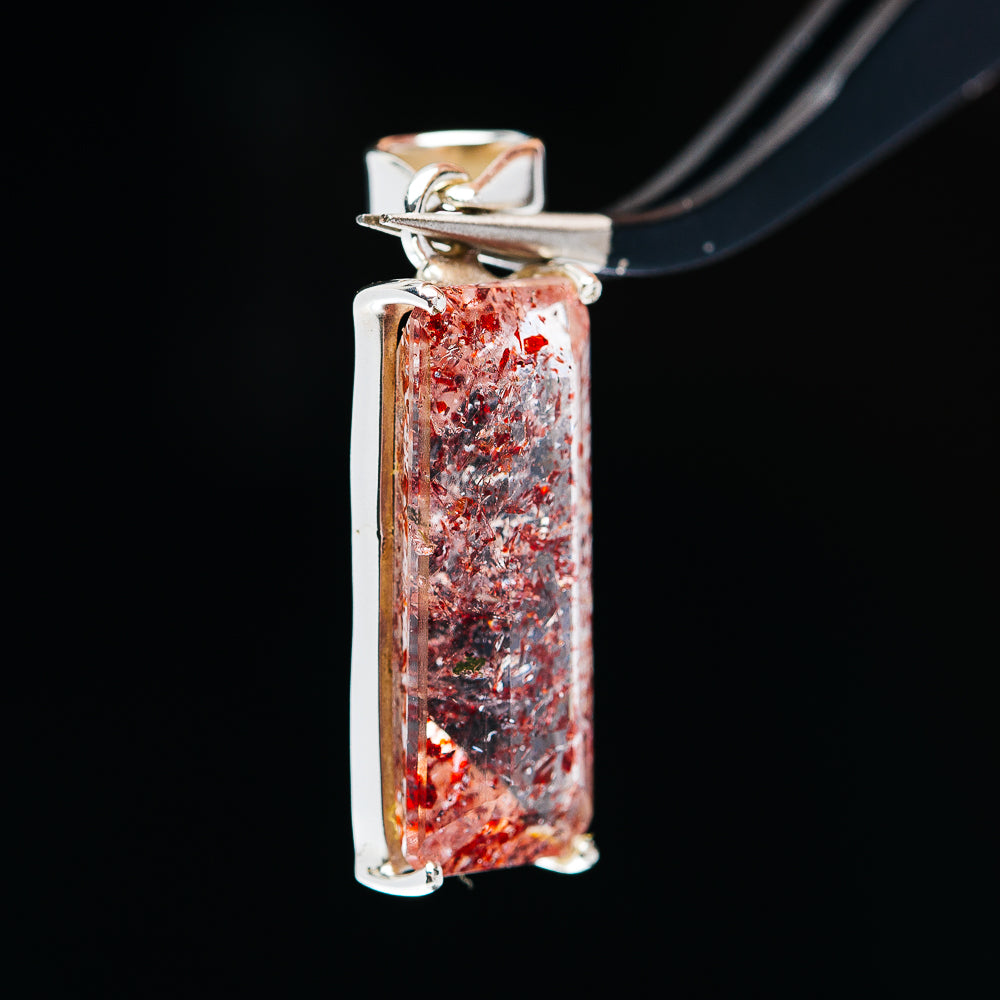 Sterling silver pendant with rectangular faceted red lepidocrocite stone bezel setting