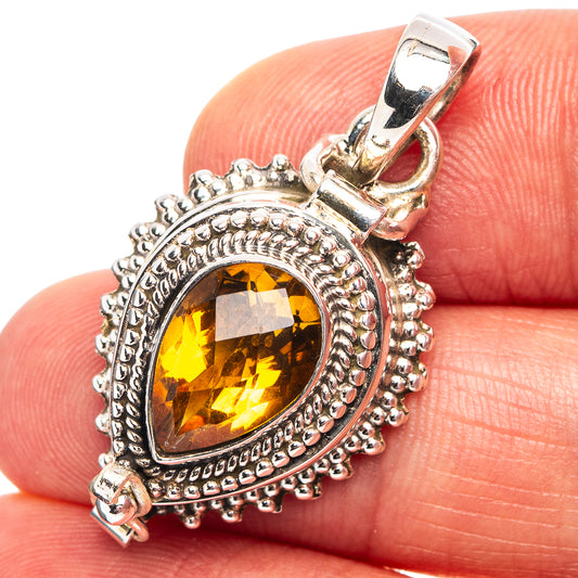 Sterling silver pendant with oval citrine gemstone and ornate bezel setting