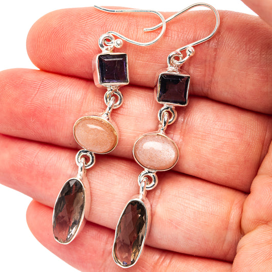 Sterling silver drop earrings with dark square and peach oval gemstones, plus dark dangle ovals
