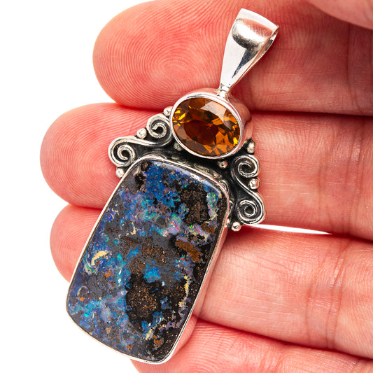 Sterling silver pendant with blue-and-black boulder opal and round amber citrine