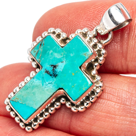 Turquoise cross pendant in sterling silver with raised beaded edge and bail