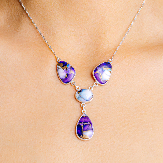 Sterling silver pendant necklace with three blue-purple teardrop charms and chain