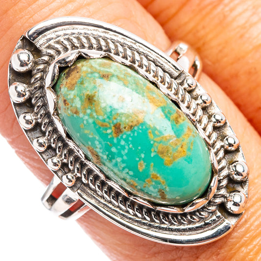 Oval turquoise cabochon sterling silver ring with ornate rope bezel and engraved outer frame