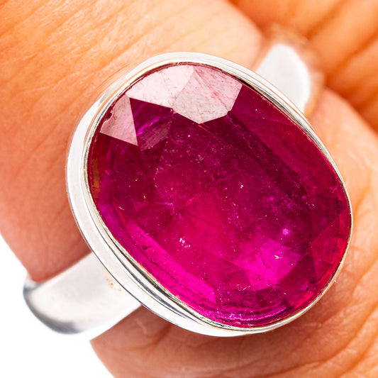 Oval ruby-colored glass ring with polished .925 sterling silver setting, size 7