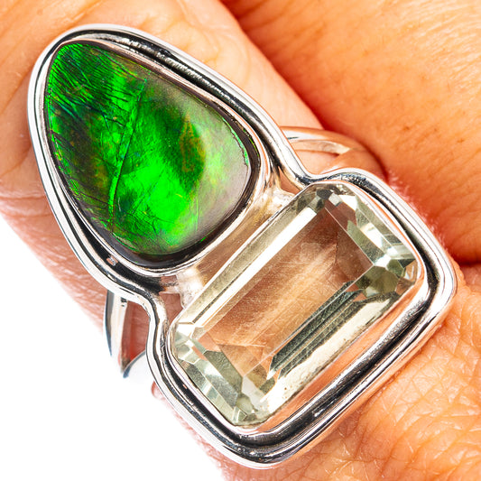 Sterling silver ring with green iridescent teardrop inlay and clear faceted stone
