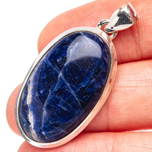 Close-up sodalite oval pendant in .925 sterling silver, polished blue stone
