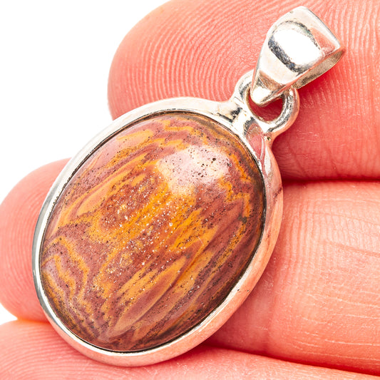 Oval snakeskin jasper pendant with .925 sterling silver bezel and loop bail, close-up