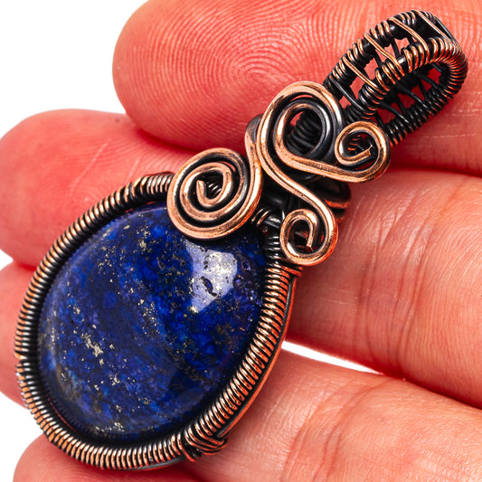 Oxidized copper wire wrap lapis lazuli teardrop pendant with spiral bezels