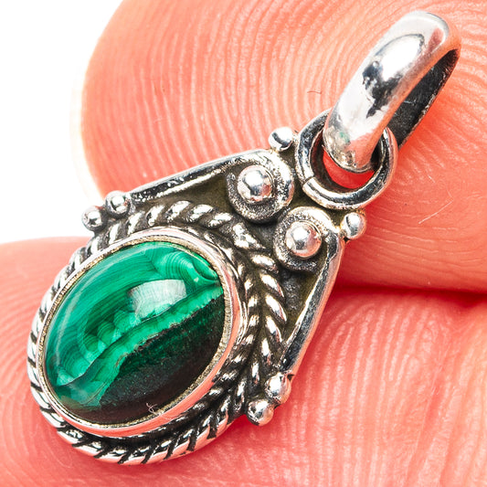 Sterling silver malachite pendant with oval green stone and ornate bezel