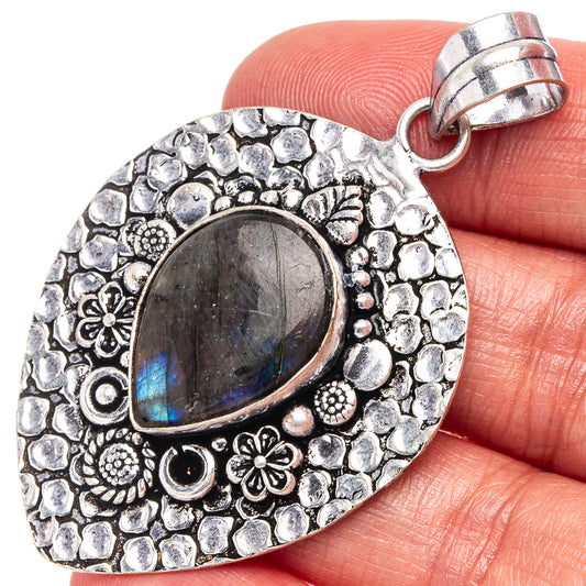 Labradorite oval cabochon pendant with German silver filigree border and loop bail