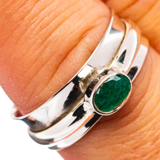 Sterling silver spinner ring with oval green emerald-style gemstone bezel setting