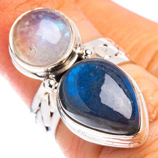 Sterling silver ring with round rainbow-lavender stone and oval deep blue gemstone cabochon