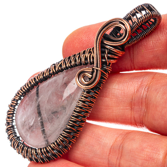 Oxidized copper wire-wrap pendant with pink teardrop quartz stone and double loops