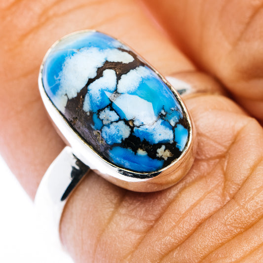 Sterling silver oval turquoise cabochon ring with blue, white, and dark matrix