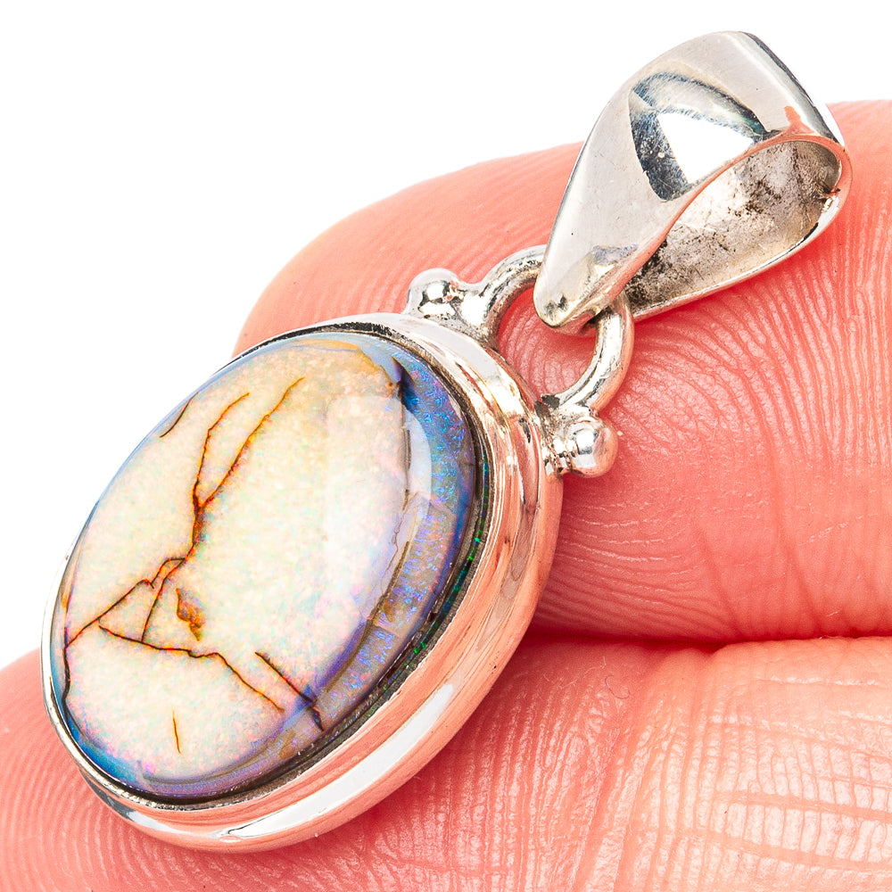 Oval opal pendant in 925 sterling silver, iridescent stone with openwork bail.
