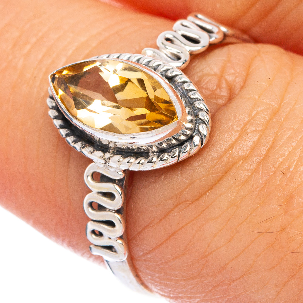 Sterling silver ring with oval faceted citrine and detailed patterned band