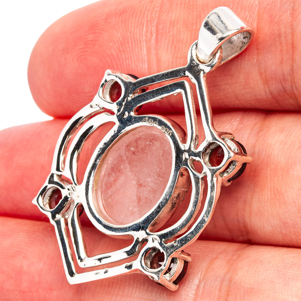 925 sterling silver pendant with oval pink stone and red garnet side stones