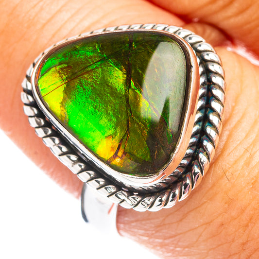 Sterling silver ammolite teardrop ring with green iridescent stone, braided edge