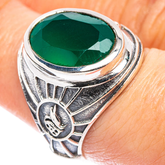 Sterling silver filigree ring with oval green gemstone centerpiece