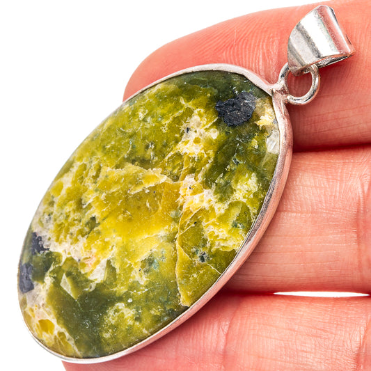 Silver-plated stichtite teardrop pendant with green, yellow, and blue stone