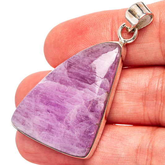 Kunzite pendant with purple faceted stone and sterling silver bezel, bail at top