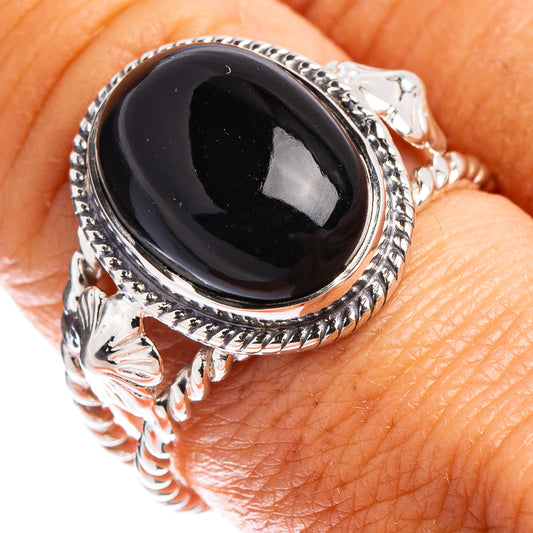Sterling silver onyx ring with oval black stone and ornate engraved band