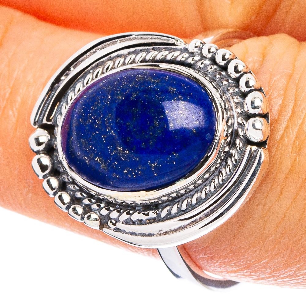 Oval lapis lazuli gemstone sterling silver ring with ornate raised bezel