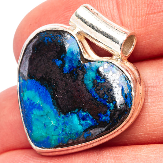 Heart pendant close-up with blue and black stone in .925 sterling silver bezel and bail