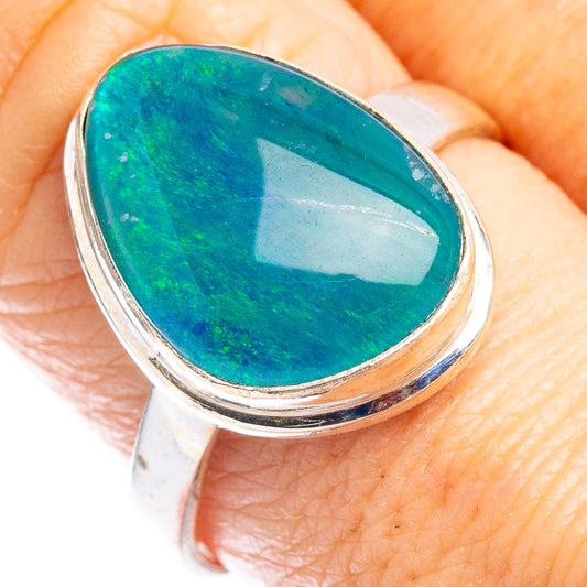 Sterling silver oval opal cabochon ring with teal-green stone in polished bezel