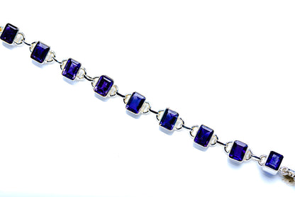 Sterling silver bracelet with small dark blue square links, chain extension