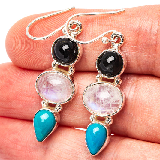 Sterling silver dangle earrings with black, pink, and turquoise gemstones