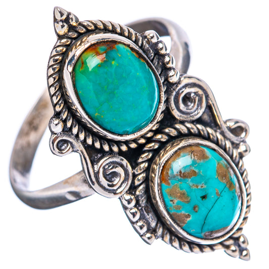 Adjustable sterling silver ring with two oval turquoise cabochons and swirl filigree