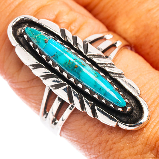 Turquoise oval ring in .925 sterling silver with black bezel and carved silver leaf design