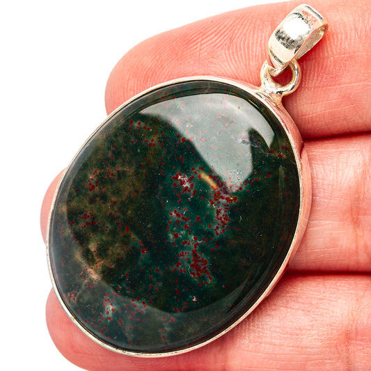 Bloodstone pendant in oval cabochon with sterling silver bail and frame
