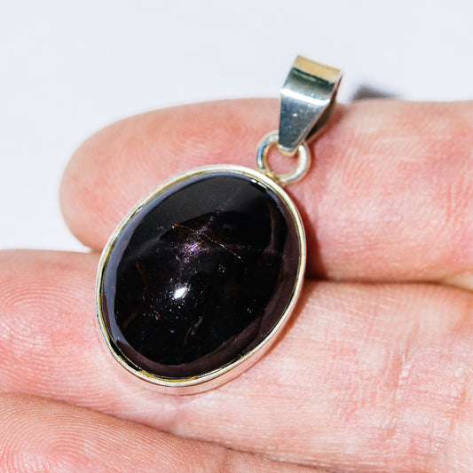 Round star garnet pendant with .925 sterling silver bezel setting