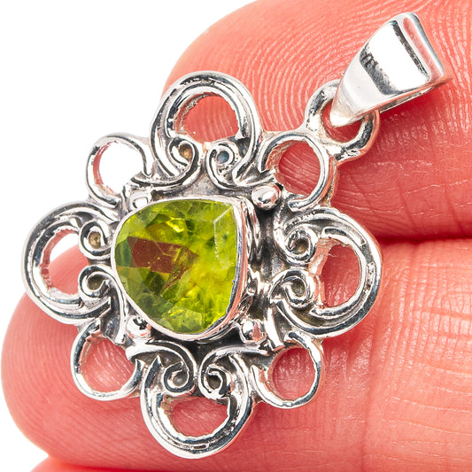 Sterling silver peridot pendant with ornate filigree and round green gemstone