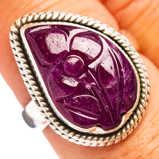 Sterling silver ring with oval carved purple ruby gemstone, rope border and ornate setting