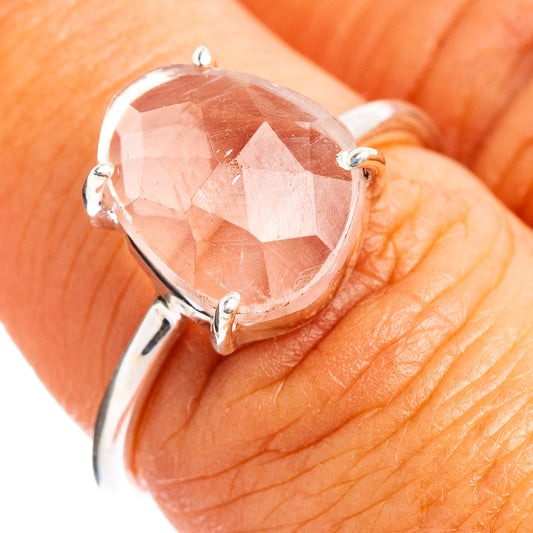 Rose quartz faceted silver ring with oval pink stone and four-prong setting