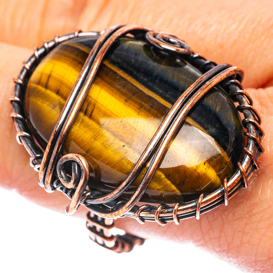 Wire-wrapped oval tiger’s eye ring, oxidized copper wire with dark edge